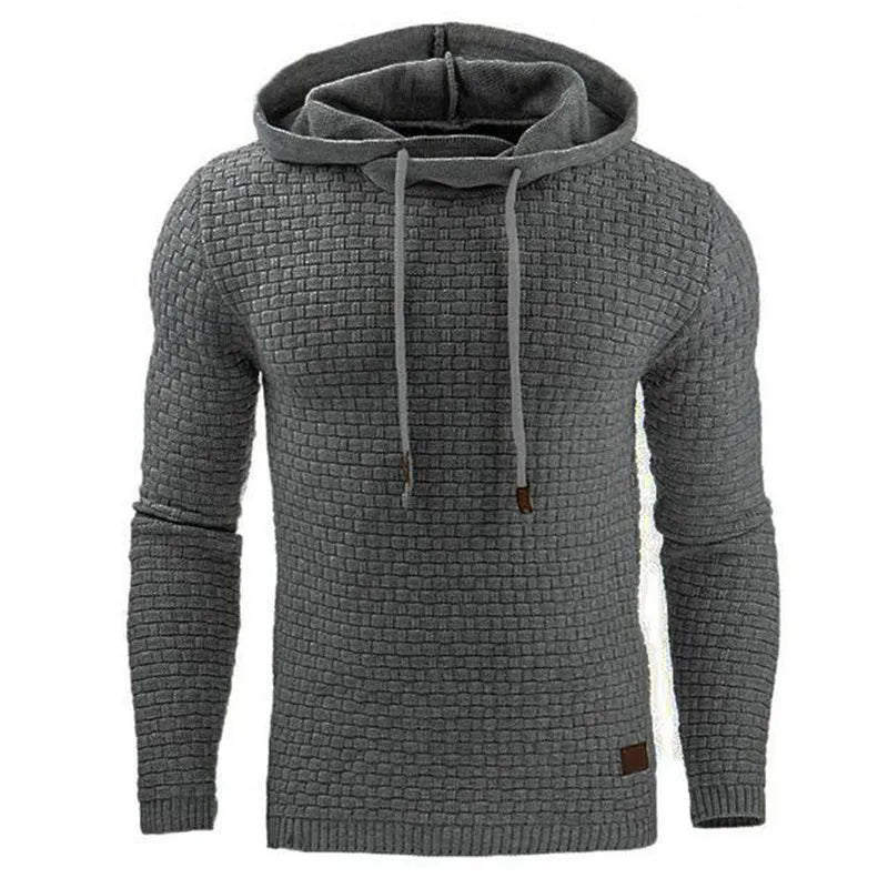 A man wearing a cotton-polyester blend hoodie available in nine colours including black, navy, and red.