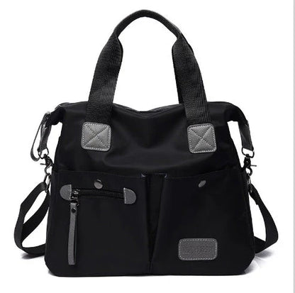 A fashionable and versatile ladies tote bag with multiple compartments and carrying options for the modern woman on the move.