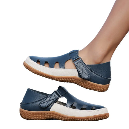 Plus size women's flat sandals with toe cap, hollow design, and thick rubber sole in blue.