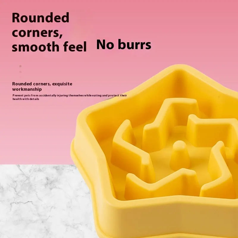Yellow plastic slow feeding dog bowl with raised obstacles at base to prevent choking