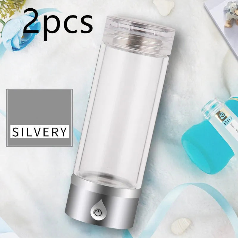 Portable hydrogen water ionizer bottle with high borosilicate glass cup in silver finish.