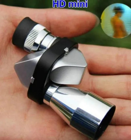Compact silver aluminium alloy monocular with foldable eyecup on a canvas bag with lens cloth.