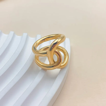 Women's stainless steel adjustable ring with a knotted detail on a geometric U-shape band.