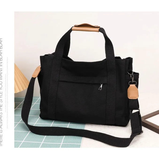 Large canvas tote bag in horizontal square shape with open-zip sides and internal organisers