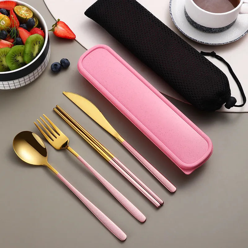 Gold and black stainless steel knife fork spoon set inside a grey mesh carrying bag.