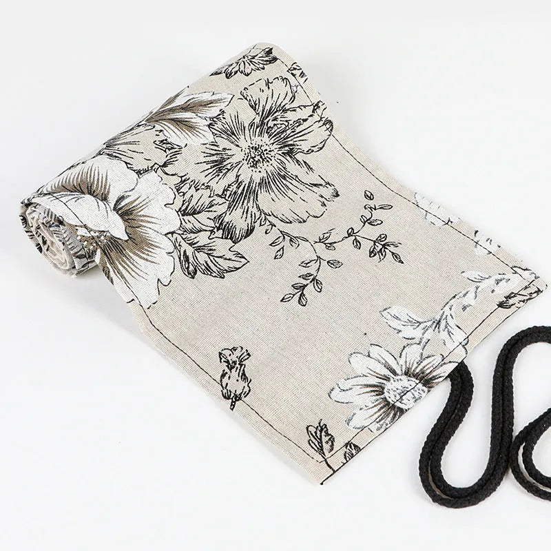 Black Peony printed cotton hemp pencil roll bag unfurled showing 24 or 72 pencil pockets.