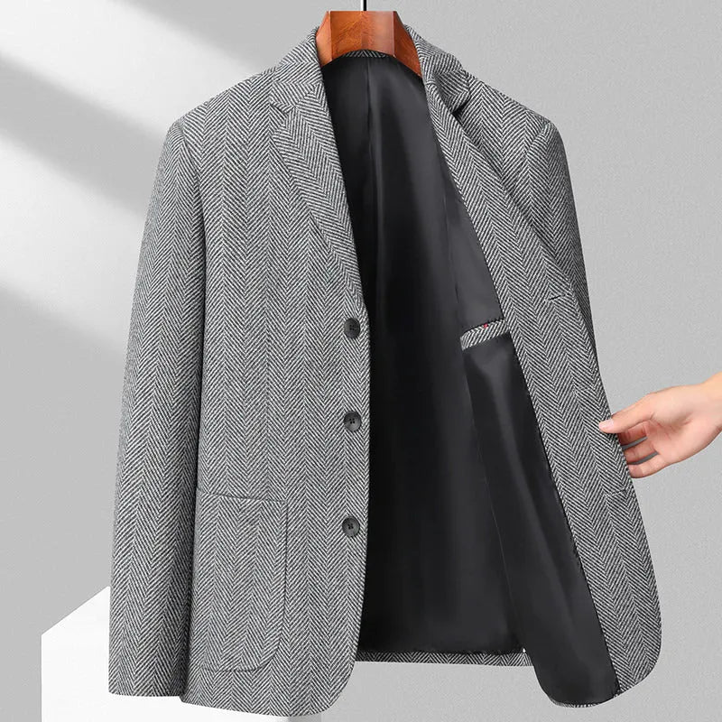 Man wearing a simple, loose-fit solid-colour casual coat in a neutral shade.