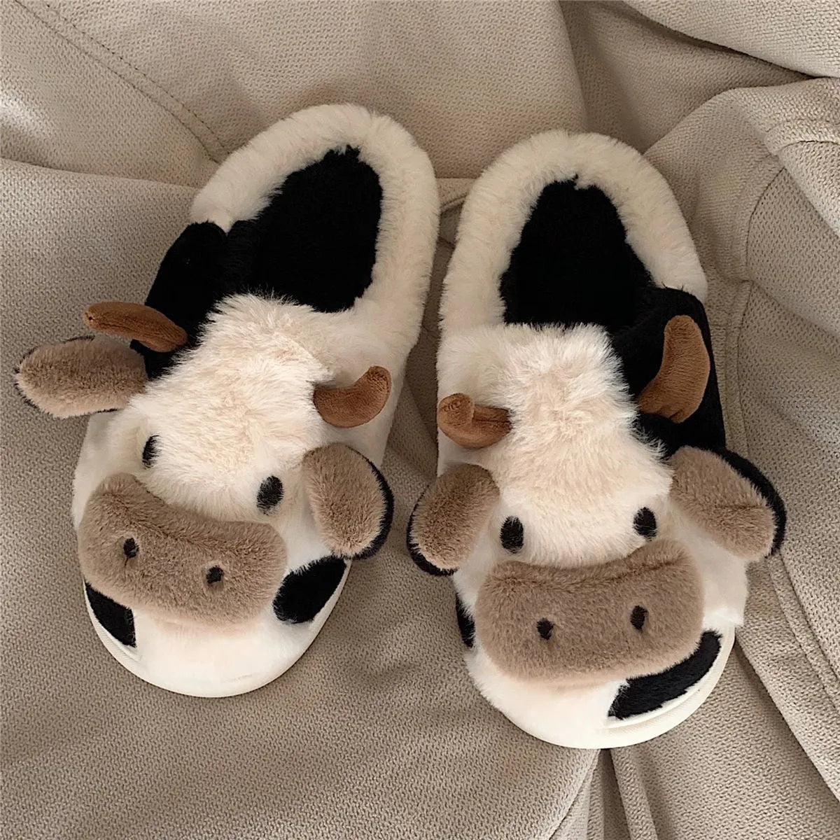 White cow animal slippers with plush faux fur and non-slip PVC soles for women