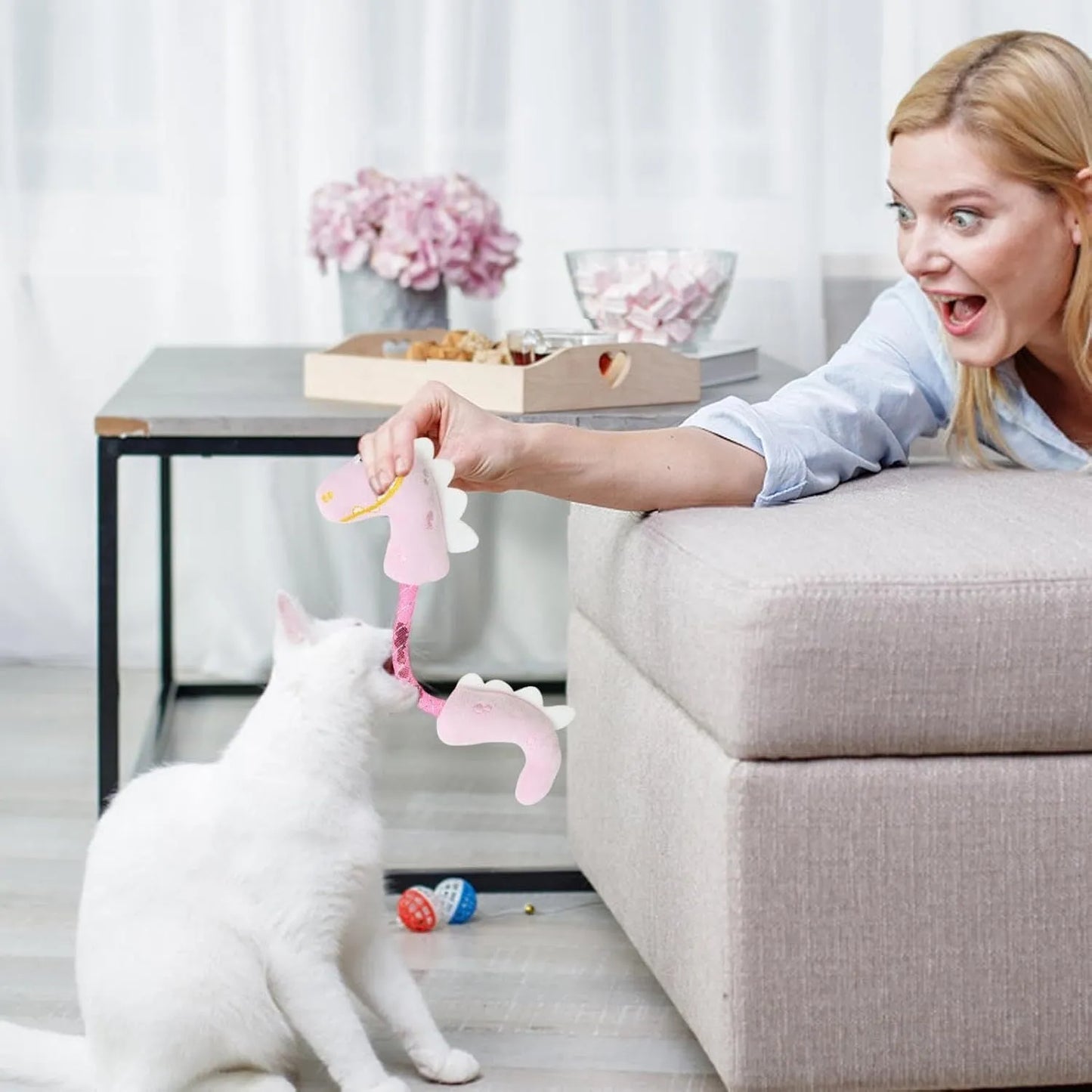 Set of four colourful plush cat toys: a mouse, a fish, a bunny, and a chew toy on a plain background.