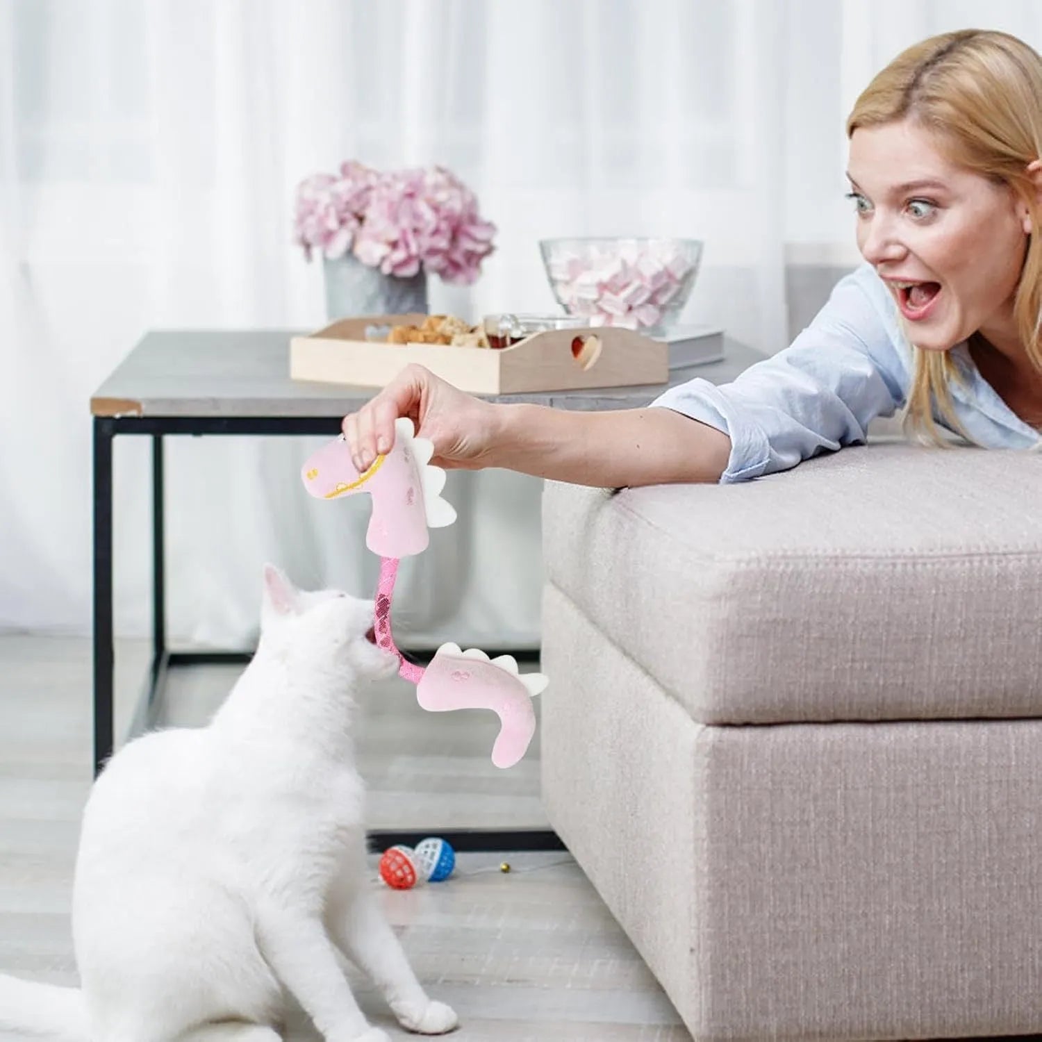 Set of four colourful plush cat toys: a mouse, a fish, a bunny, and a chew toy on a plain background.
