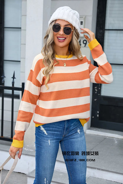 Women's loose blue striped acrylic sweater with long sleeves and round neck.