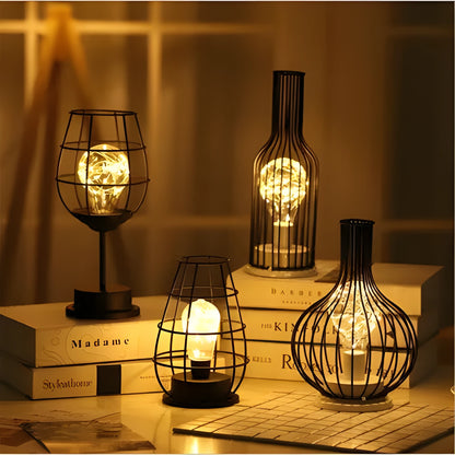 Minimalist wrought iron table lamp shaped like wine bottle with warm white LED light