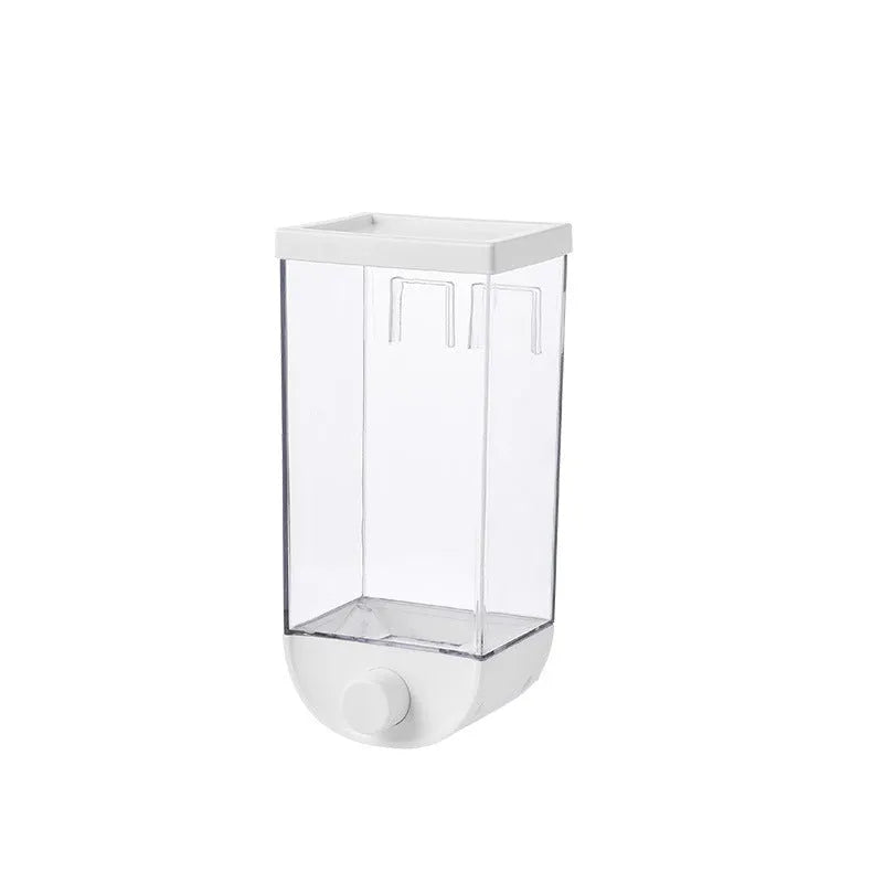 White wall-mountable kitchen food storage box with press lid dispenser, showing transparent body with cereal inside.