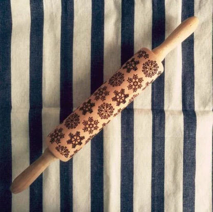 Festive rolling pin with embossed Christmas designs for easy imprinting on dough