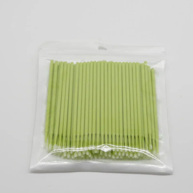 Disposable micro applicator brushes with coloured plastic handles and bendable cotton swab tips