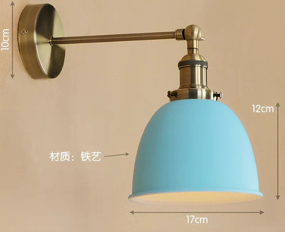 Bedroom wall light with 15cm wide iron shade in pink colour, mounted 20cm projection for soft illumination