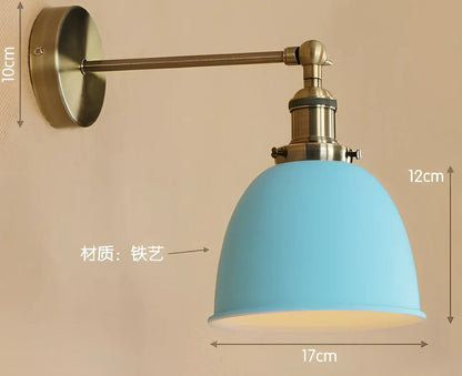 Bedroom wall light with 15cm wide iron shade in pink colour, mounted 20cm projection for soft illumination