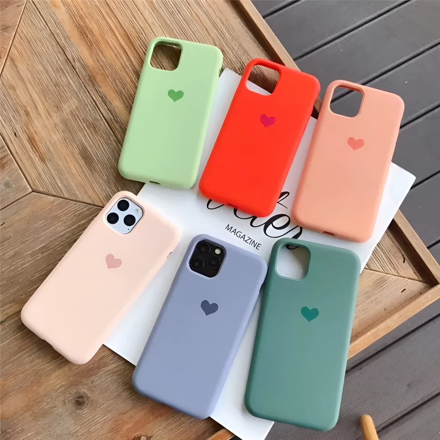Solid colour silicone iPhone case shown in six colour options including dark green, flour and light pink.