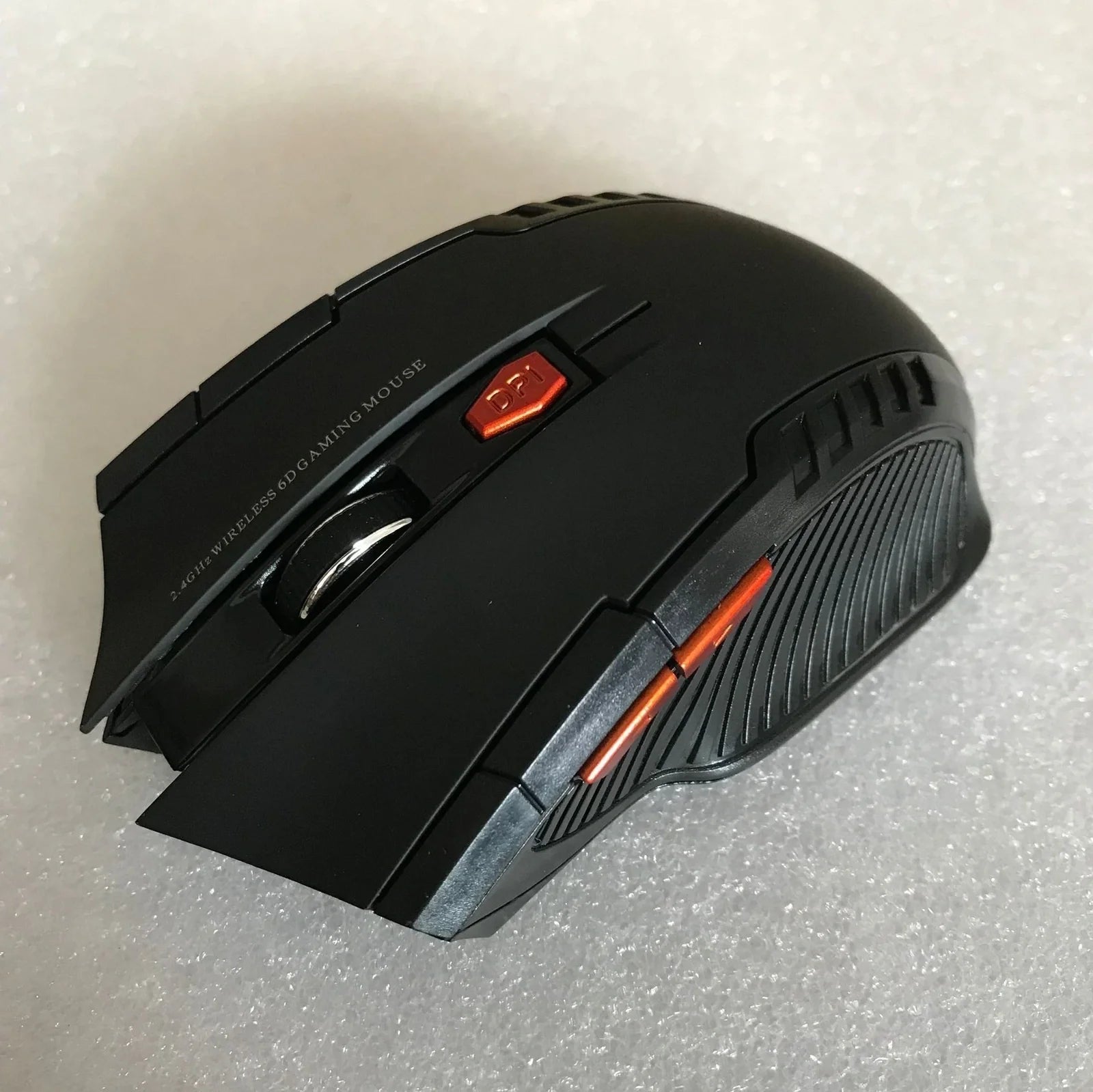 Black wireless computer mouse with six buttons and USB receiver, 100-120mm size