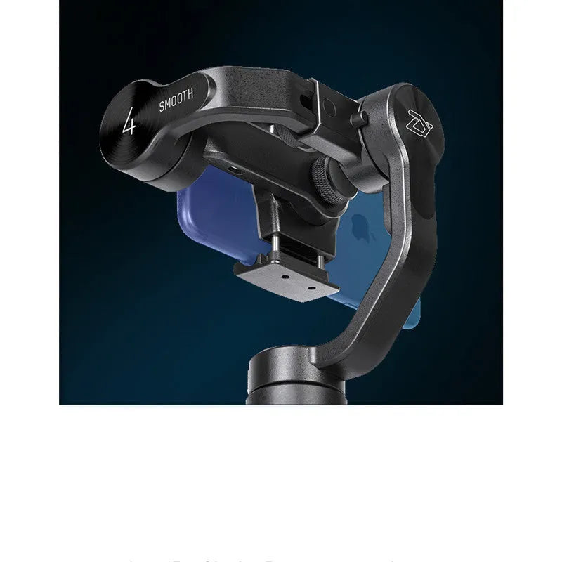 Black mobile phone handheld stabiliser gimbal on table with smartphone mounted