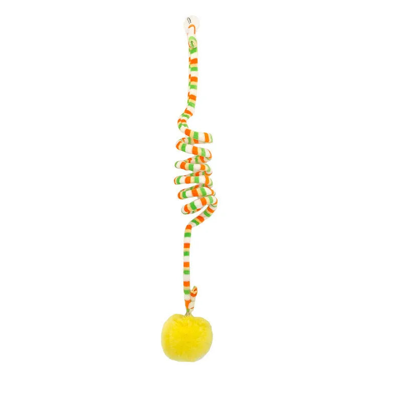 Hanging cat toy with spring, bell, and inflatable ball attached to a door via a suction cup.