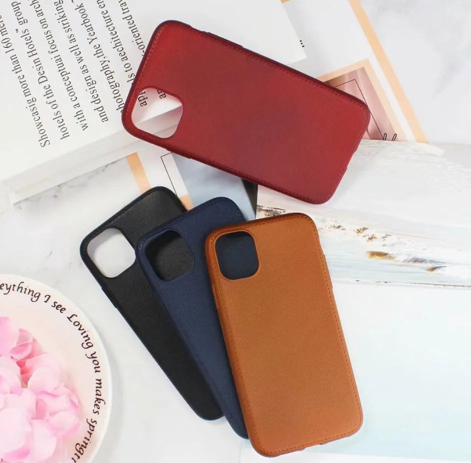 Leather-textured TPU phone case for iPhone in black, brown, navy blue, or wine red colour options.