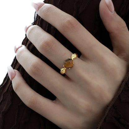 Adjustable silver ring with tiger eye stone centrepiece and shell design in electroplated finish