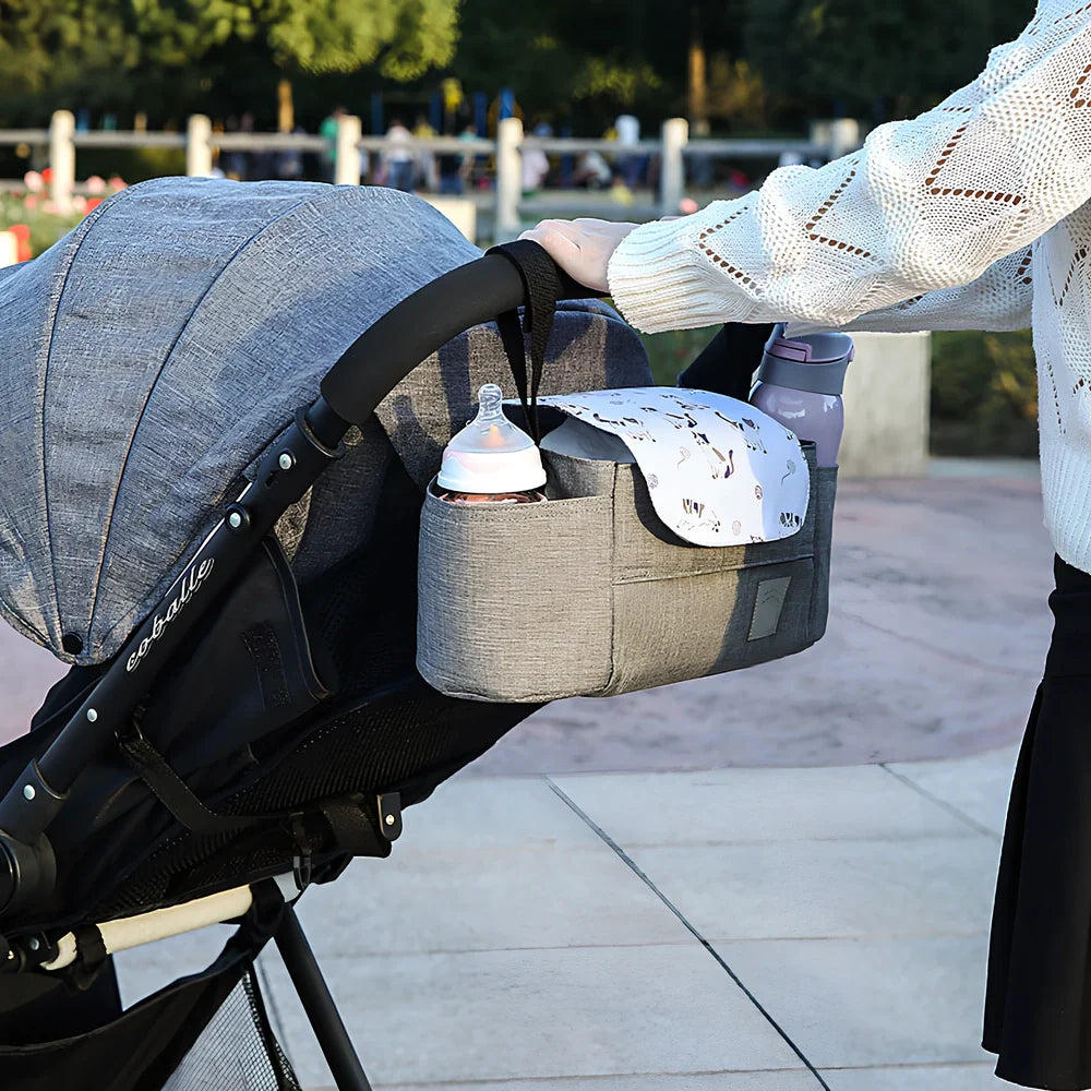 35cm wide baby stroller organiser with compartments and velcro dust cover mounted on pram pole