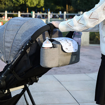 35cm wide baby stroller organiser with compartments and velcro dust cover mounted on pram pole