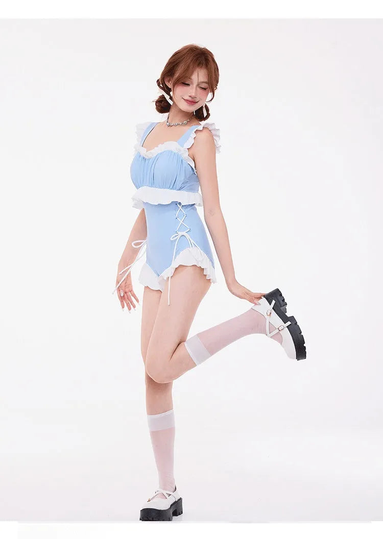 Light blue women's one-piece swimsuit with high waist, backless design, and lace detail on the chest.