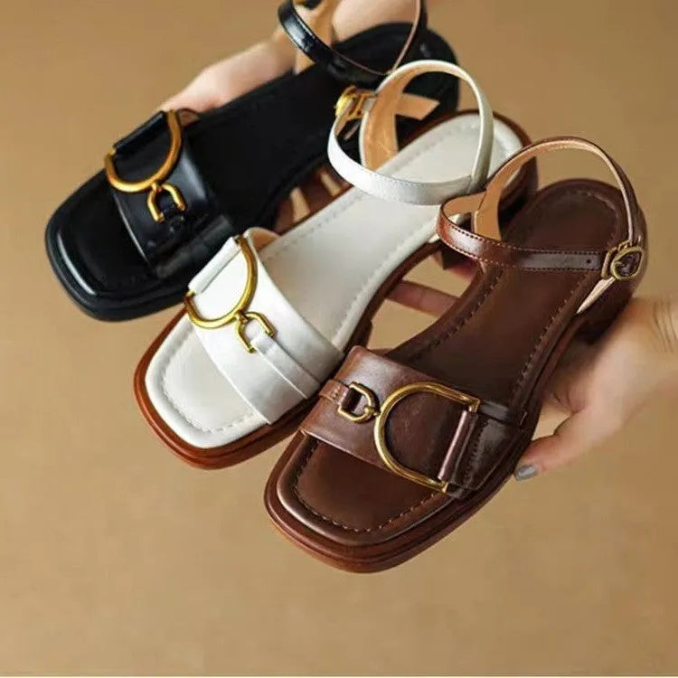 Women's black thick-soled casual sandals with round toe and a single button fastening across the instep.