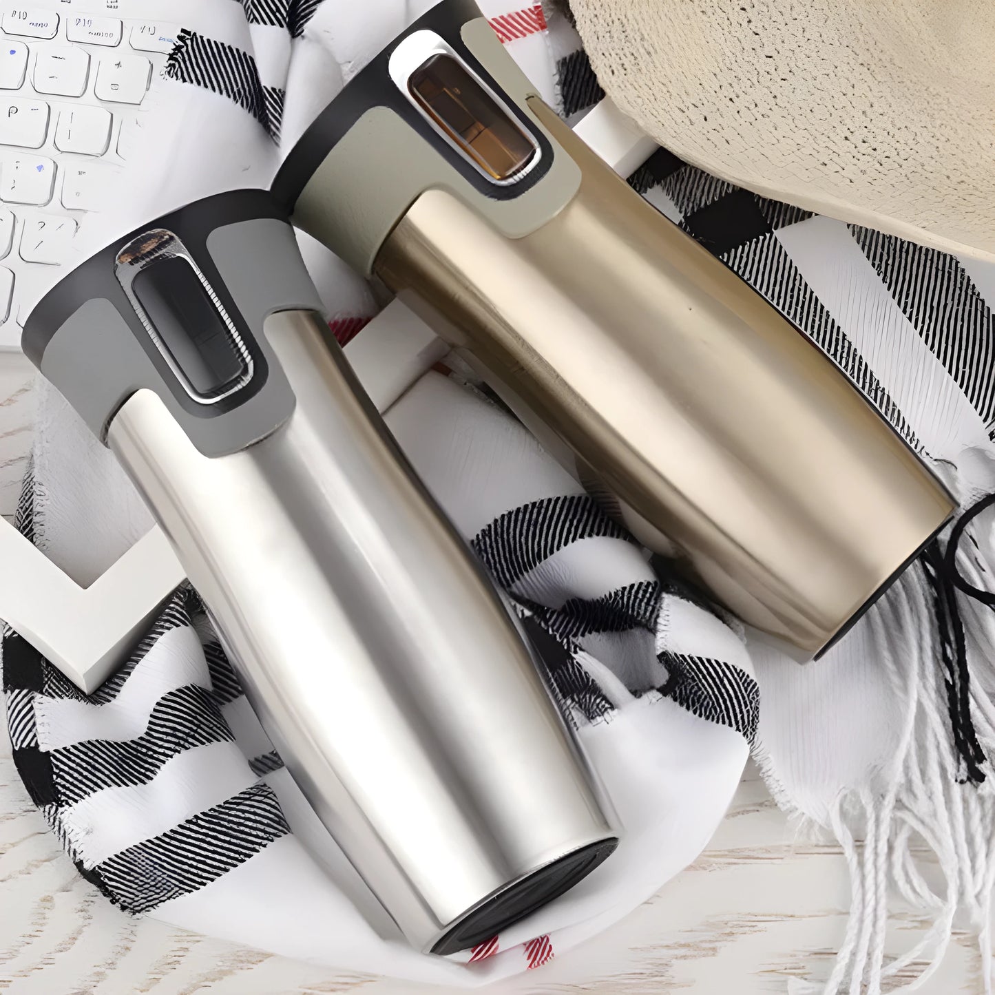 Black vacuum insulated stainless steel travel flask with push-button lid, 450ml capacity.