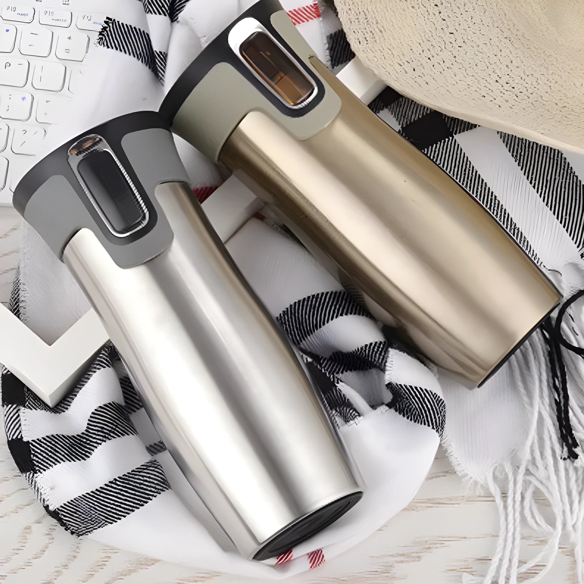 Black vacuum insulated stainless steel travel flask with push-button lid, 450ml capacity.
