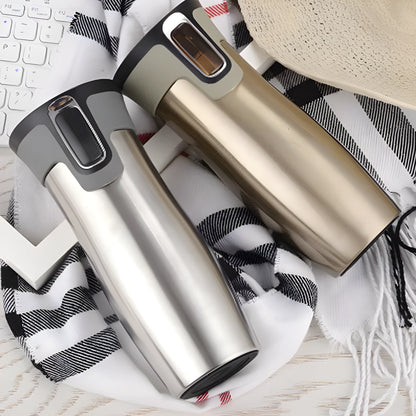 Black vacuum insulated stainless steel travel flask with push-button lid, 450ml capacity.
