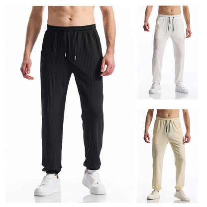 Silky rib fabric baggy straight-leg casual trousers with an elastic drawstring waist in khaki colour.
