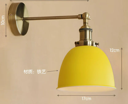 Bedroom wall light with 15cm wide iron shade in pink colour, mounted 20cm projection for soft illumination
