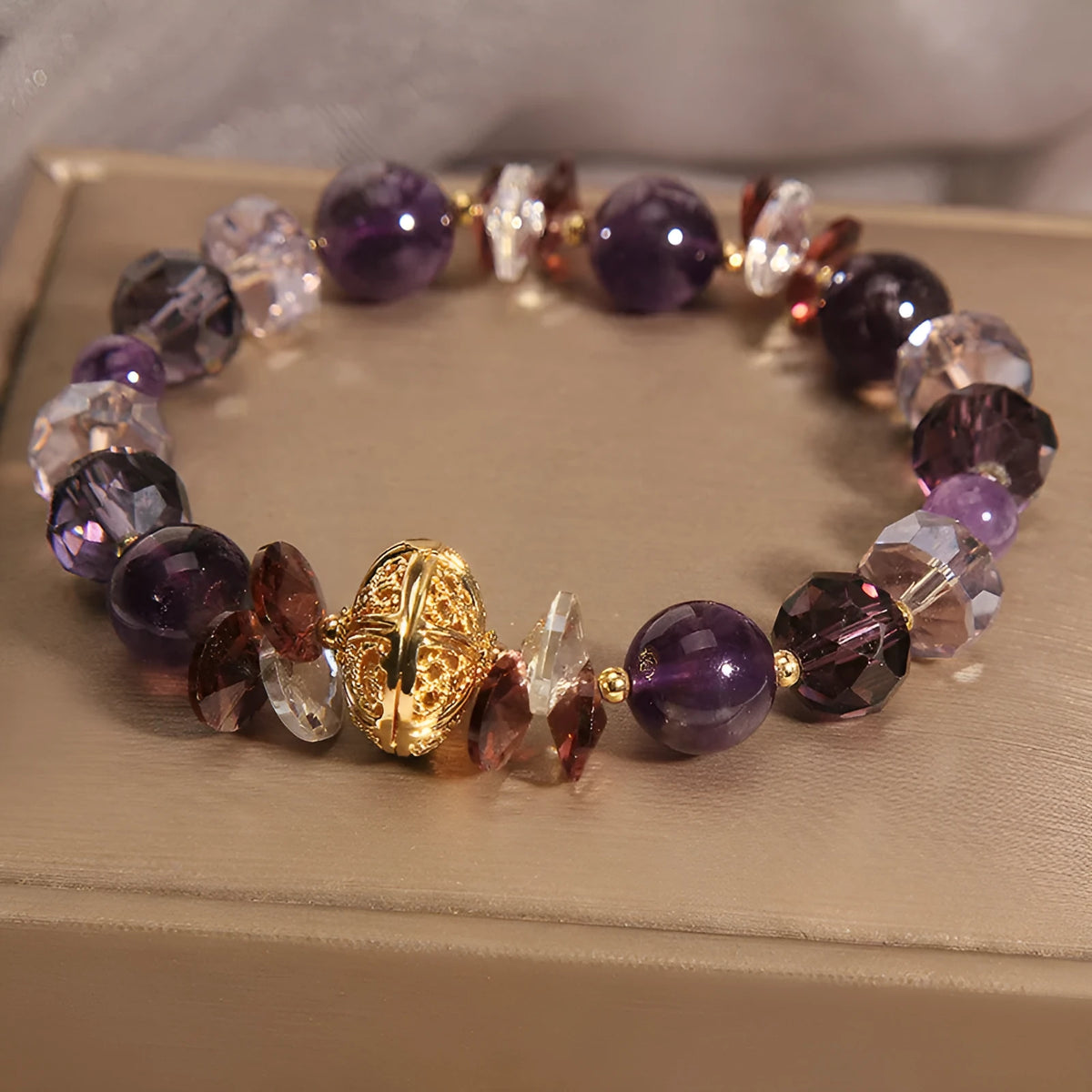 Purple crystal bracelet with pumpkin beads and rhinestone decoration