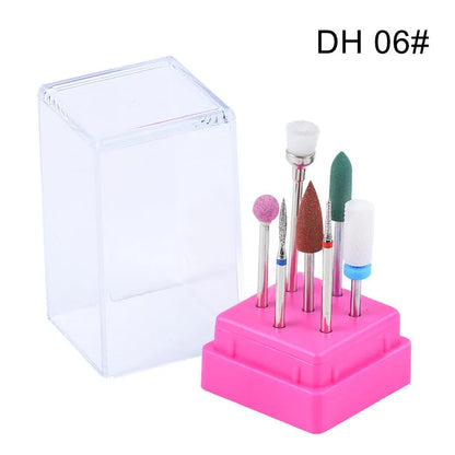 Set of six tungsten steel nail drill bits and a brush in a clear plastic case.