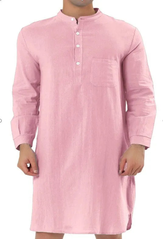 Man wearing a dark blue cotton shirt robe with button front, long sleeves, and side pockets.