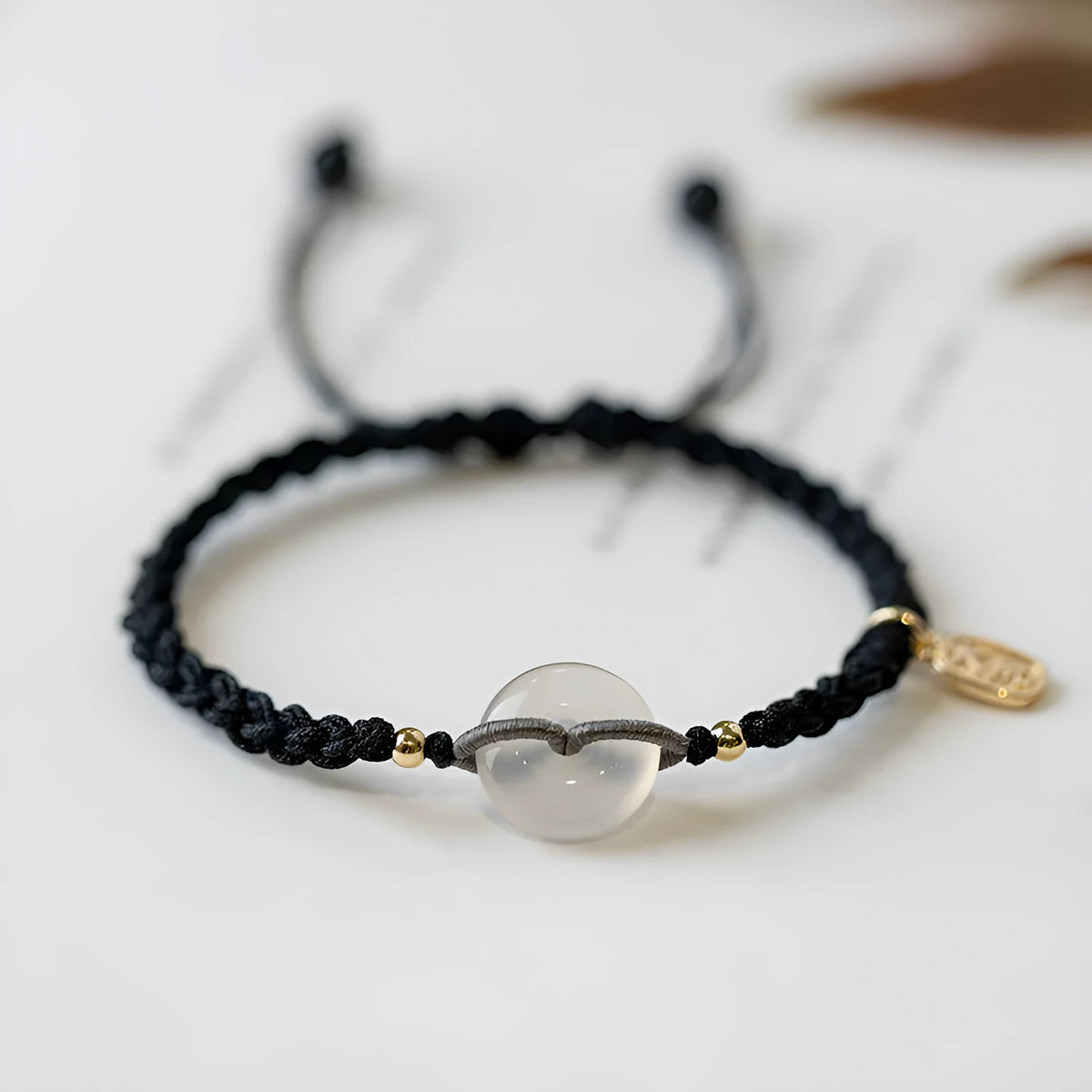 Ethnic style crystal bracelet with vintage woven strap and chamfered square grain details