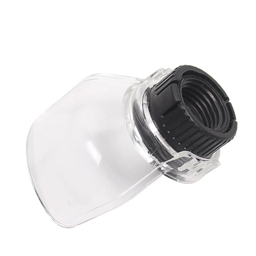 Transparent horn-shaped safety cover for a Delta angle grinder on a workshop bench.