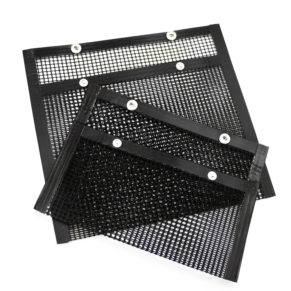Black grill mesh bag with non-stick grid mat for BBQ cooking showing smoke-through design