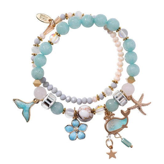Whale tail bracelet with retro flower and starfish accents, a charming nautical accessory for UK fashionistas