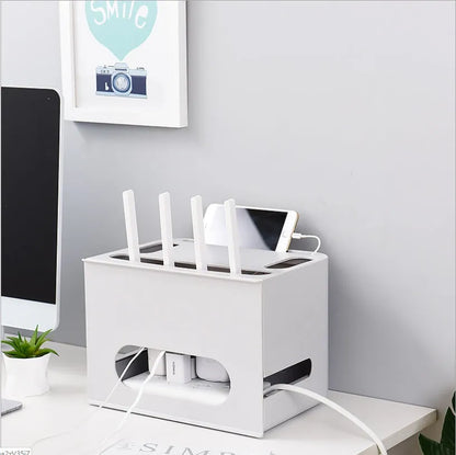 A grey and a white plastic storage box for organising a wireless router and its cables.
