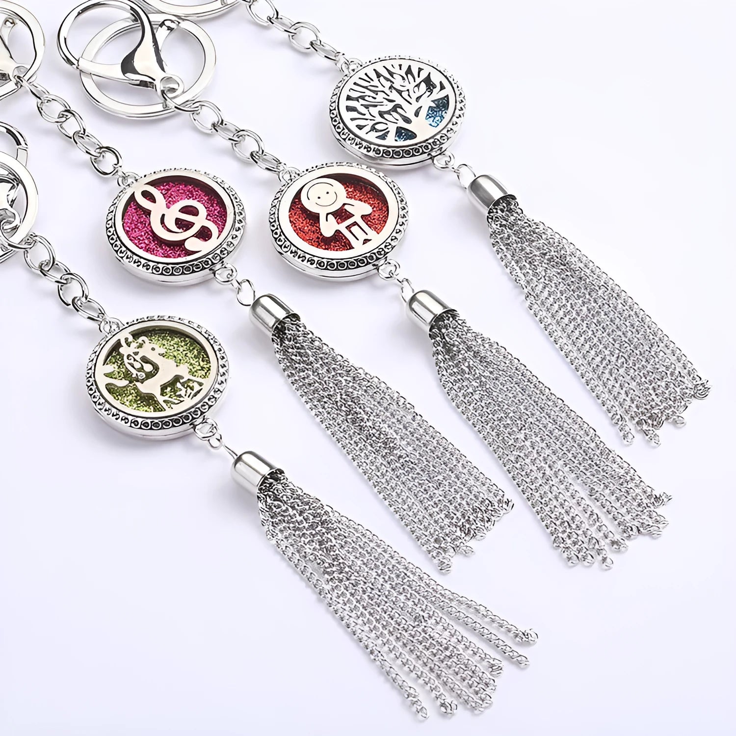 Alloy car aromatherapy pendant with tassel on 50cm chain beside coloured cotton pads for fragrance diffusion