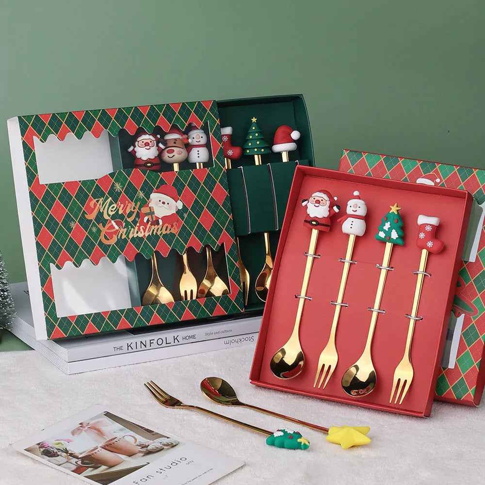Red-handled stainless steel Christmas spoons and forks with snowman and tree designs.