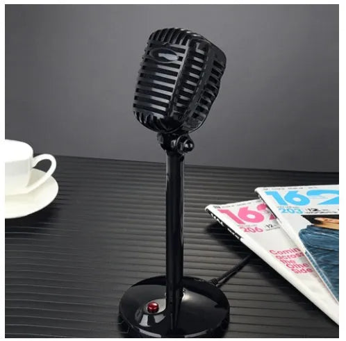 Black USB computer microphone with adjustable gooseneck and weighted silicone base stand on a desk.