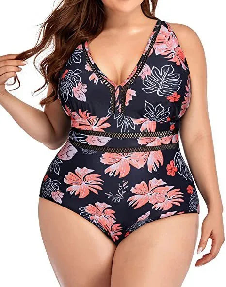 Black plus size bikini swimsuit with print design for women, shown on a hanger.