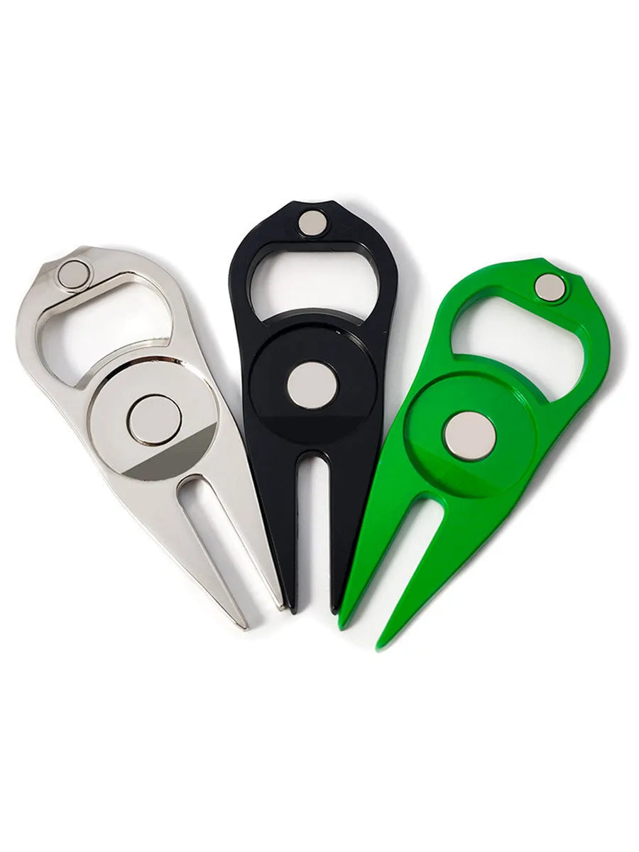 Black zinc alloy golf ball fork and bottle opener tool on a putting green.