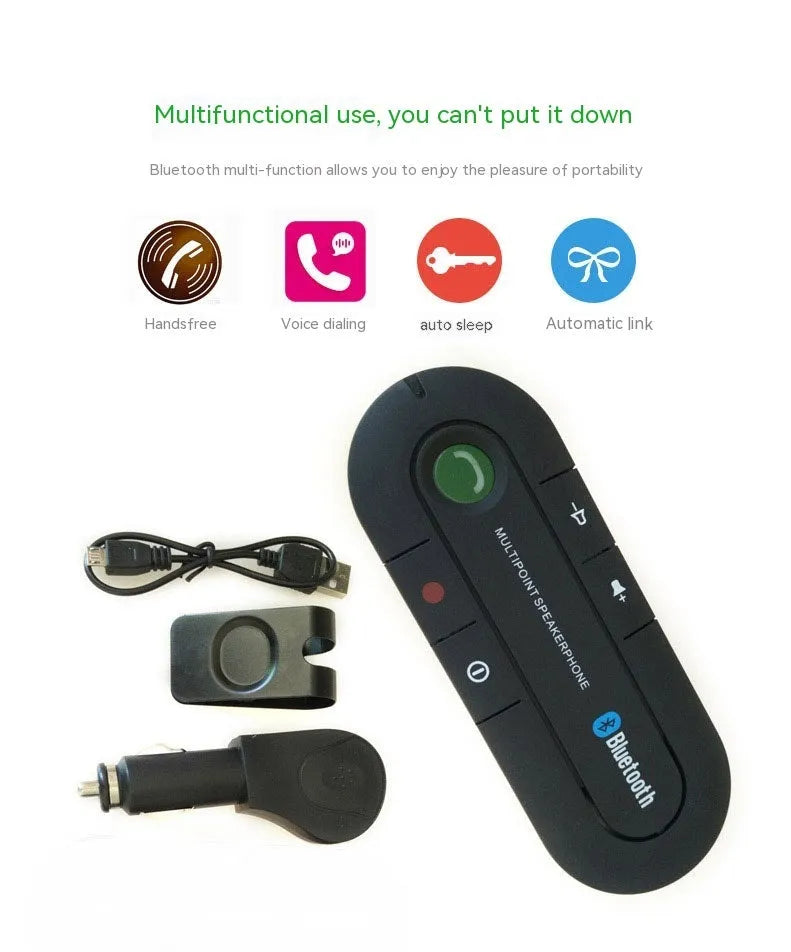 Black Bluetooth hands-free car kit mounted on a car sun visor with charger and cable.